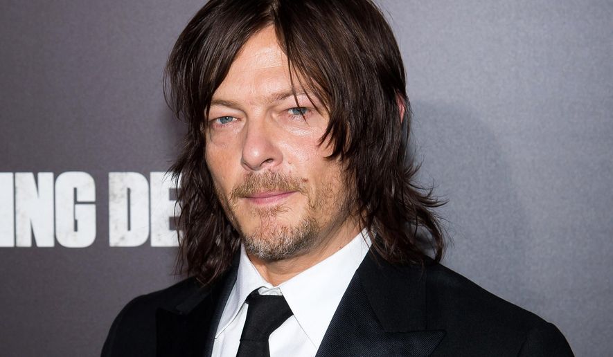 FILE - In this Oct. 9, 2015 file photo, actor Norman Reedus attends AMC's "The Walking Dead" season six premiere fan event in New York. Reedus, who plays zombie-plagued Daryl Dixon on the hit AMC thriller, is hitting the road in a new AMC reality show as he takes viewers on a biker journey exploring motorcycle culture. The series, with the working title “Ride with Norman Reedus,” debuts in 2016. (Photo by Charles Sykes/Invision/AP, File)