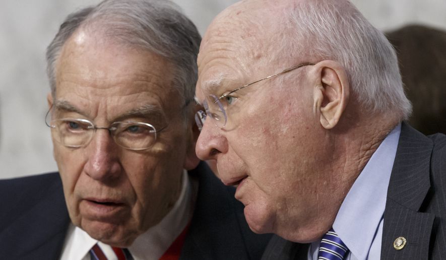 Senate Judiciary Committee Chairman Chuck Grassley (left) and ranking member Patrick Leahy (right) are shown in this January 2015 file photo. (Associated Press) **FILE**