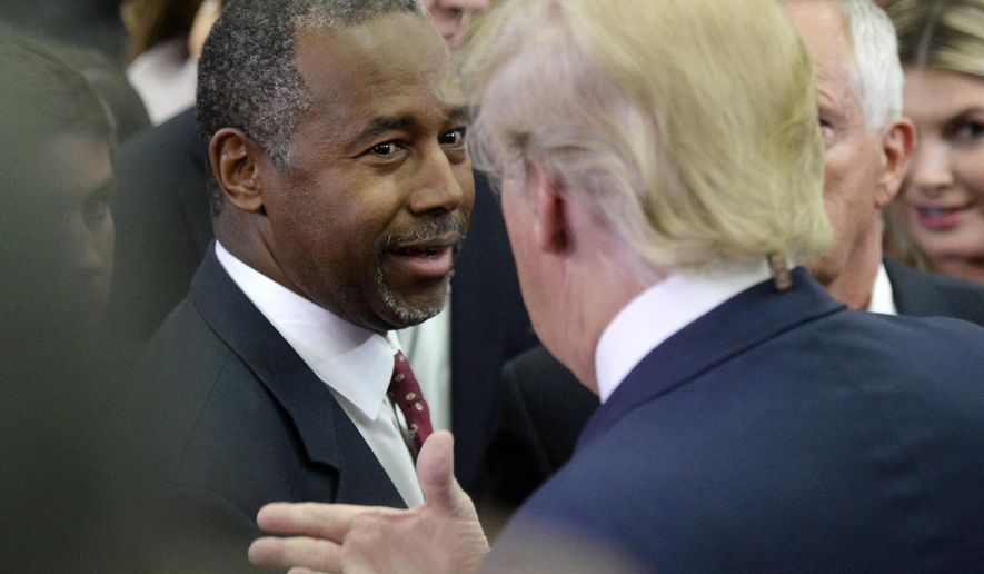 Republican presidential candidate Dr. Ben Carson, left, and Republican presidential candidate Donald Trump talk after the CNBC Republican presidential debate Wednesday, Oct. 28, 2015, at the Coors Event Center on the University of Colorado campus in Boulder, Colo. (Jeremy Papasso/Daily Camera via AP) NO SALES; MANDATORY CREDIT