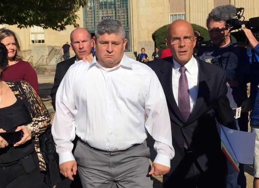 Hempstead Village Police Officer Louis Arcila, center, leaves court in Mineola, N.Y., accompanied by his attorney William Petrillo, after pleading not guilty to sexual abuse and official misconduct charges, Thursday, Oct. 29, 2015. Authorities allege that Arcila groped a woman after she ignored him when he threatened to issue her a summons during an off-duty encounter in a restaurant on June 28, 2015. (AP Photo/Michael Balsamo)