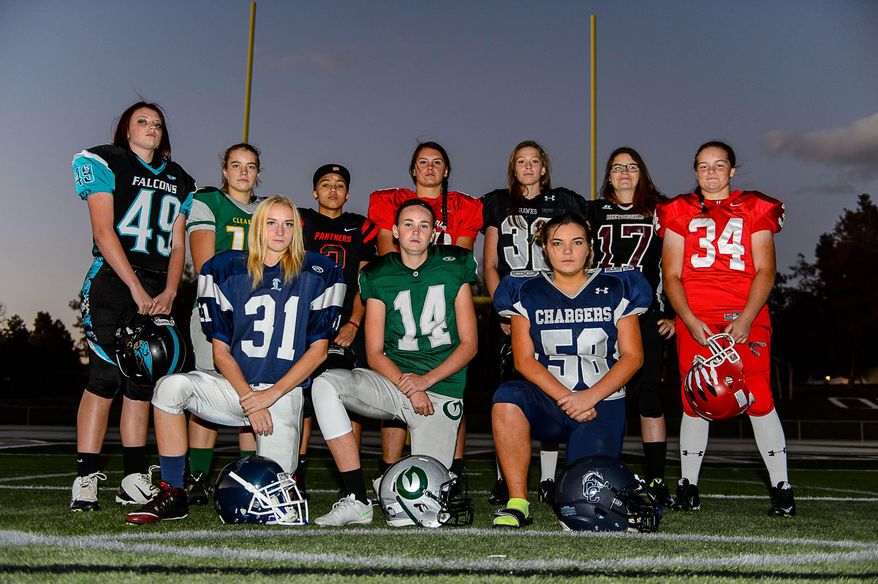 Several of the girls playing high school football in Utah pose for a portrait Wednesday, Oct. 21, 2015, in Salt Lake City. Front row, from left, are Abby Pruitt, of Layton, Ashley Denning, of Olympus, and Bailie Appleton, of Corner Canyon. Back row, left to right, are Morgan Cheney, of Canyon View, Taylor Stevens, of Clearfield, Izzy Martinez, of West, Morgan Lukrich, of Park City, Jacquelyn Hanks, of Alta, Jacinda Riehm, of Jordan, and Emmalee Mayes, of Uintah. (Trent Nelson/The Salt Lake Tribune via AP) DESERET NEWS OUT; LOCAL TELEVISION OUT; MAGS OUT; MANDATORY CREDIT