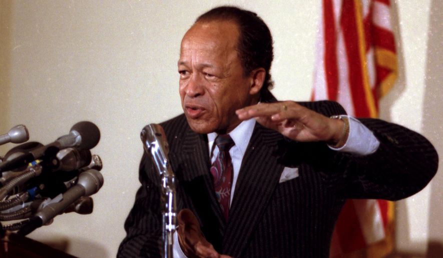 FILE - In this March 30, 1990 file photo, Rep. Gus Savage, D-Ill., speaks at a news conference on Capitol Hill in Washington. Savage, a civil rights activist and journalist who represented a South Side Chicago district for 12 years in the U.S. House, died on Saturday, Oct. 31, 2015, a day after celebrating his 90th birthday. (AP Photo/Charles Tasnadi)