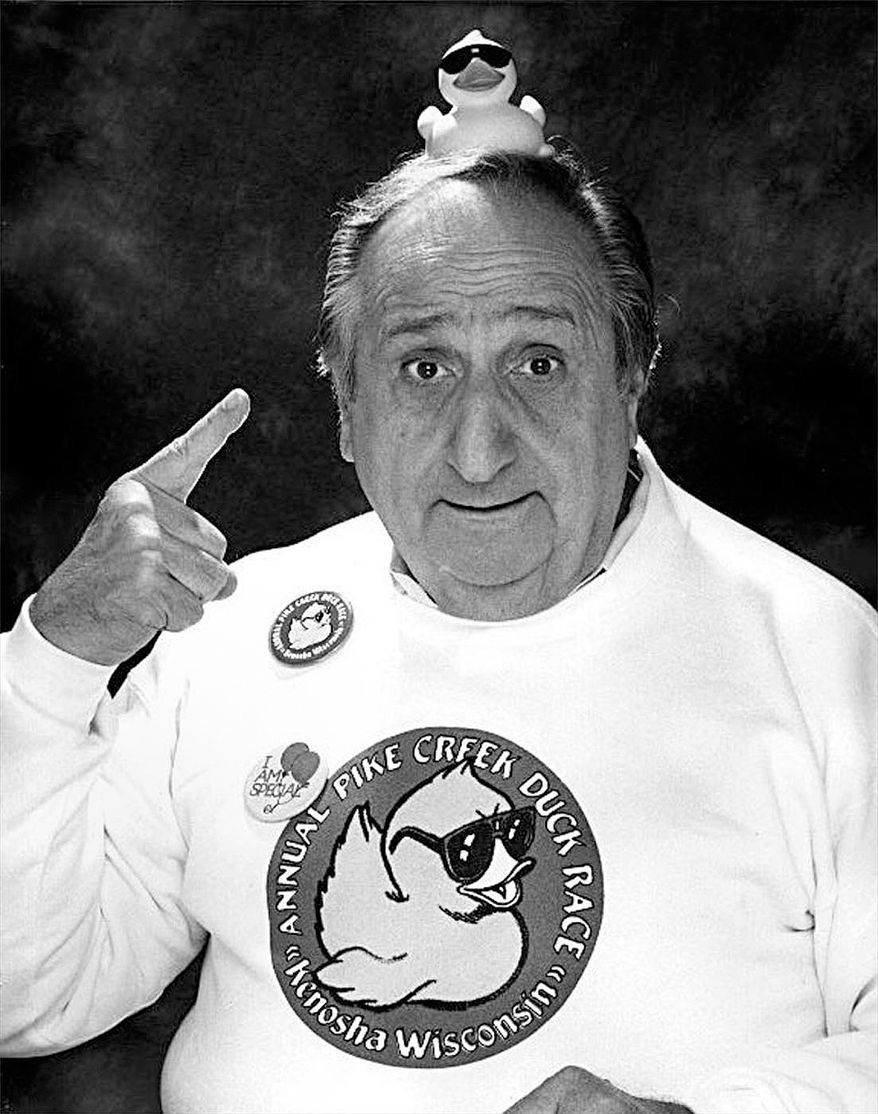 In this file photo, date not known, actor Al Molinaro points to a plastic duck on his head, while promoting a fund-raising event in his hometown of Kenosha, Wis. Molinaro, the loveable character actor with the hangdog face who was known to millions of TV viewers for playing Murray the cop on "The Odd Couple" and malt shop owner Al Delvecchio on "Happy Days," died Friday, Oct. 30, 2015, at Verdugo Hills Hospital in Glendale, Calif., at age 96. (Kenosha News via AP, File)