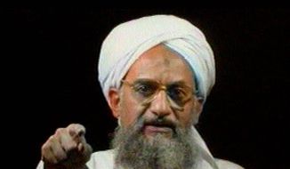 In this file image from television transmitted by the Arab news channel Al-Jazeera on Monday,  Jan. 30, 2006, Al Qaeda&#39;s then deputy leader Ayman al-Zawahri gestures while addressing the camera. (AP Photo/Al-Jazeera, File)