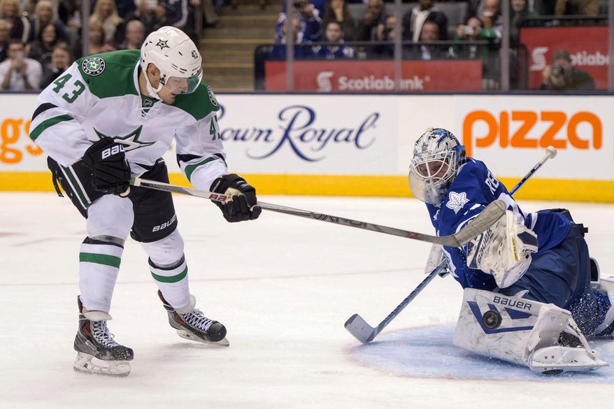 Toronto Maple Leafs goaltender James Reimer makes a save on a penalty shot by Dallas Stars right winger Valeri Nichushkin during third period of an NHL hockey game in Toronto, Monday, Nov. 2, 2015. (Frank Gunn/The Canadian Press via AP) MANDATORY CREDIT