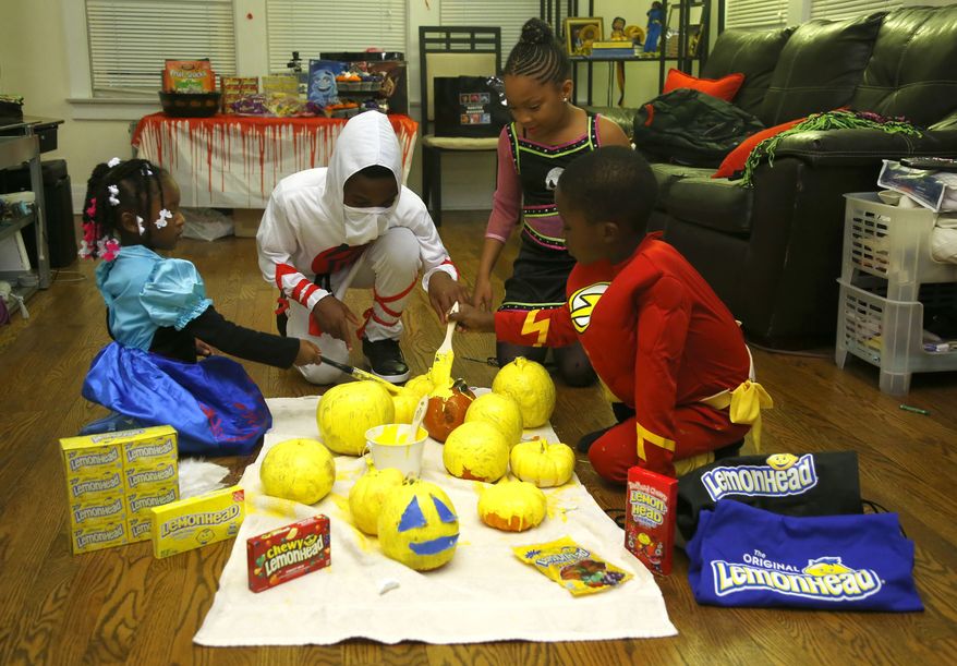 On Halloween 2014 kids in Forest Park, Illinois, home to the Ferrara Candy Company's factory since 1908, celebrated the newest trend this year, known as #Yelloween. Designed to celebrate Lemonhead, one of the most sought-after trick-or-treat candies year-over-year, kids nationwide painted their pumpkins Yellow this year, reminding everyone that Yellow truly is the new orange. Lemonhead is the iconic sweet and sour candy brand known and loved since it first starting tantalizing taste buds in 1962. Log on to Facebook.com/Lemonhead to learn more. (PRNewsFoto/Ferrara Candy Company) THIS CONTENT IS PROVIDED BY PRNewsfoto and is for EDITORIAL USE ONLY**