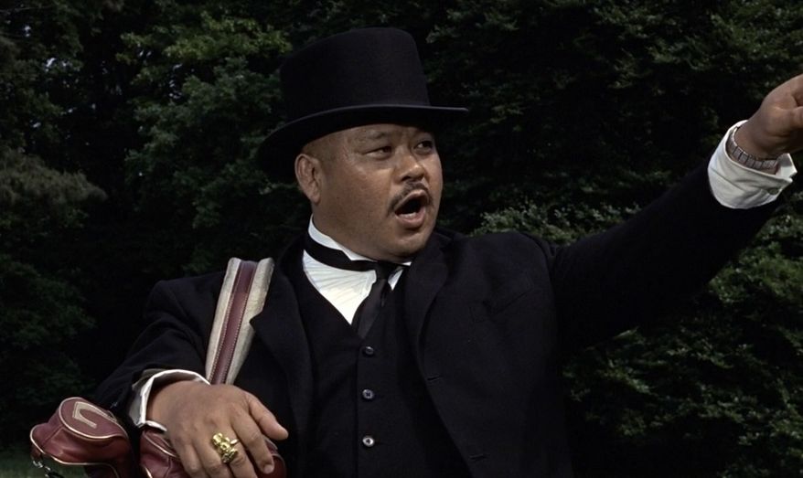 In Goldfinger, the character Oddjob never utters a line, but he does say one word. What is it?