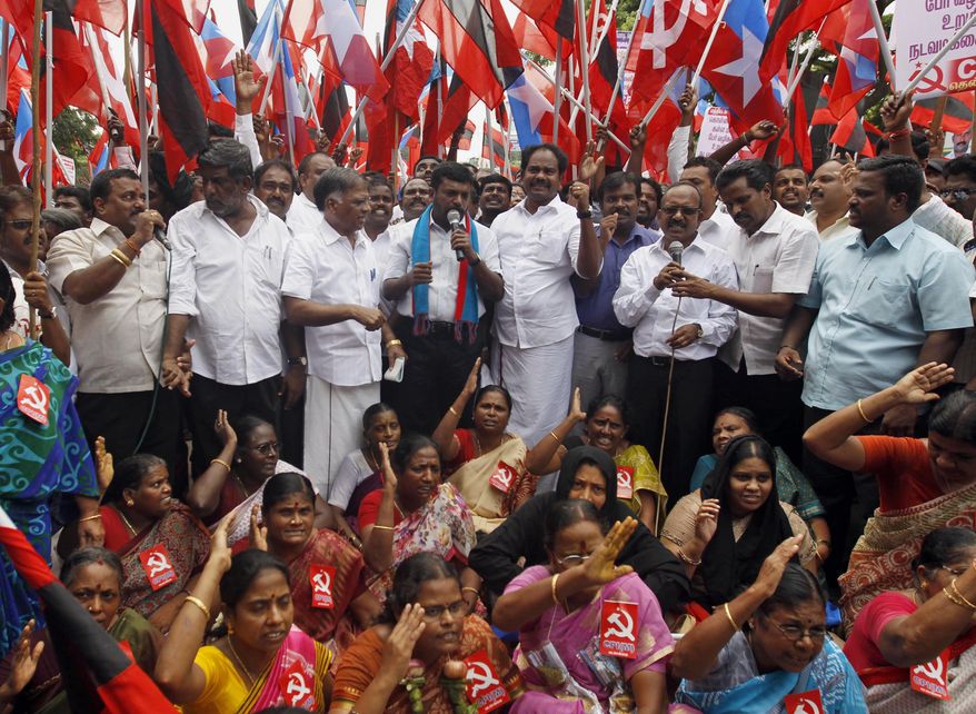 Members of Communist Party of India and Liberation Panthers participate in a protest in Chennai, India, Tuesday, Nov. 3, 2015. An international rights group on Tuesday demanded the release of an Indian folk singer arrested S. Kovan on charges including sedition for writing songs criticizing a state official for not banning liquor sales. (AP Photo/Arun Sankar K.)