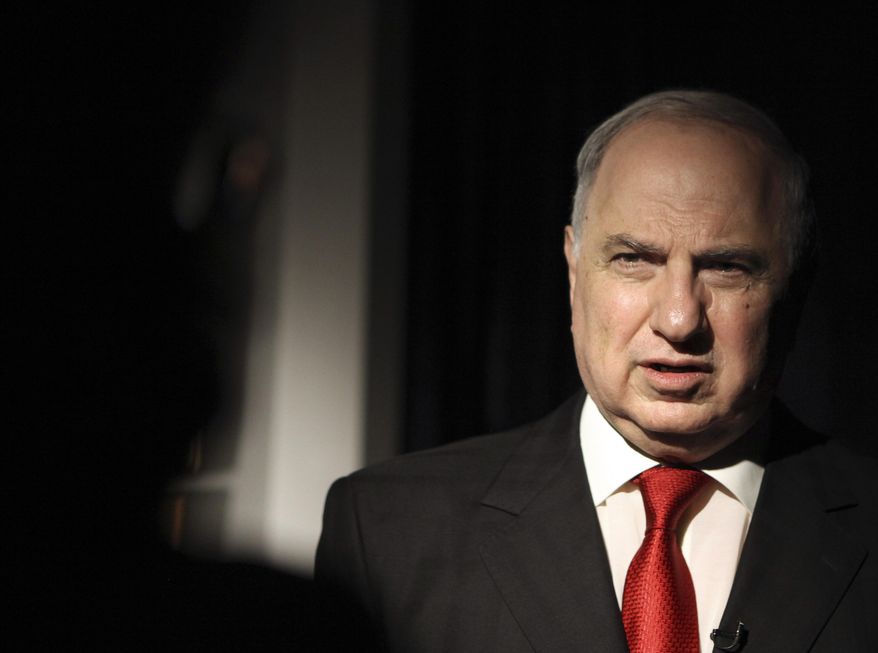FILE - In this Wednesday, May 5, 2010 file photo, Ahmad Chalabi, the head of the Accountability and Justice Committee speaks during an interview with The Associated Press in Baghdad. Iraqi state TV says Chalabi, a prominent politician who strongly advocated the 2003 U.S.-led invasion to overthrow Saddam Hussein, has died of a heart attack at the age of 70.(AP Photo/Karim Kadim, File)