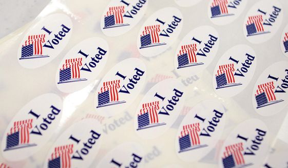 In this June 3, 2014, file photo, &amp;quot;I Voted&amp;quot; stickers sit on the registration table at the Canyon Lake Senior Center polling place in Rapid City, S.D. (AP Photo/Toby Brusseau, File)