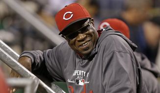 Cincinnati Reds manager Dusty Baker (12) stands in the dugout during a baseball game against the Pittsburgh Pirates in Pittsburgh Saturday, Sept. 21, 2013. The Pirates won 4-2. (AP Photo/Gene J. Puskar)