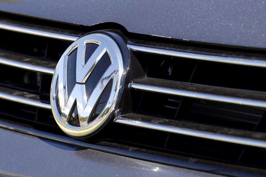 FILE - In this Thursday, Sept. 24, 2015, file photo, the grille of a Volkswagen car for sale is decorated with the iconic company symbol in Boulder, Colo. Germany's Volkswagen, already reeling from news that it had cheated on U.S. tests for nitrogen oxide emissions, said Tuesday, Nov. 3, that an internal investigation had revealed "unexplained inconsistencies" in the carbon dioxide emissions from 800,000 vehicles that could cost the company another 2 billion euros ($2.2 billion). The revelation comes after VW's admission in September that it rigged emissions tests for four-cylinder diesel engines on 11 million cars worldwide, including almost 500,000 in the U.S. It has already set aside 6.7 billion euros ($7.4 billion) to cover the costs of recalling those vehicles. (AP Photo/Brennan Linsley, File)