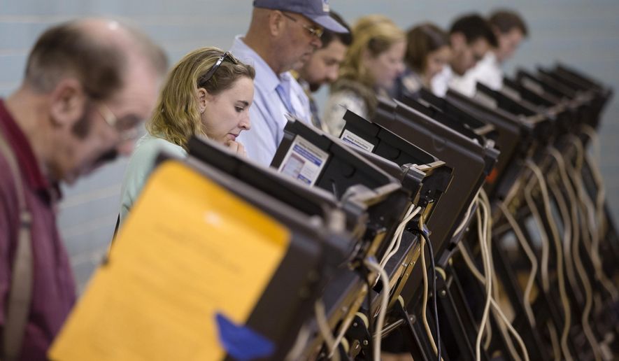 Computer security experts said bar codes on ballots and smartphones in voting locations could give hackers a chance to rewrite results in ways that couldn&#39;t be traceable. (Associated Press/File)