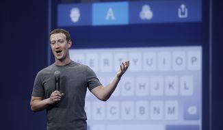 In this March 25, 2015, photo, Mark Zuckerberg talks about the Messenger app during the Facebook F8 Developer Conference in San Francisco. Facebook reports quarterly financial results on Wednesday, Nov. 4, 2015. (AP Photo/Eric Risberg, File)