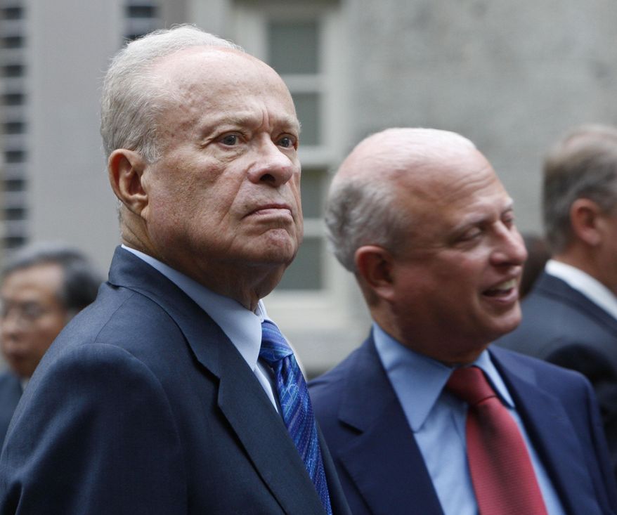 FILE - In this Sept. 22, 2009, file photo, Washington Nationals owner Ted Lerner, left, and his son Mark Lerner, right, attend a reception for Baseball Hall of Famer Tommy Lasorda at the Smithsonian's National Portrait Gallery in Washington. A New York state judge has thrown out an arbitration decision that said the Mid-Atlantic Sports Network, which is controlled by the Baltimore Orioles, owes the Washington Nationals about $298 million for the team's 2012-16 television rights. MASN and the Orioles sued in New York State Supreme Court last year, claiming the arbitration was improper because the law firm Proskauer Rose, which represented the Nationals, at times worked for MLB and the teams of all three arbitrators. (AP Photo/Pablo Martinez Monsivais, File)