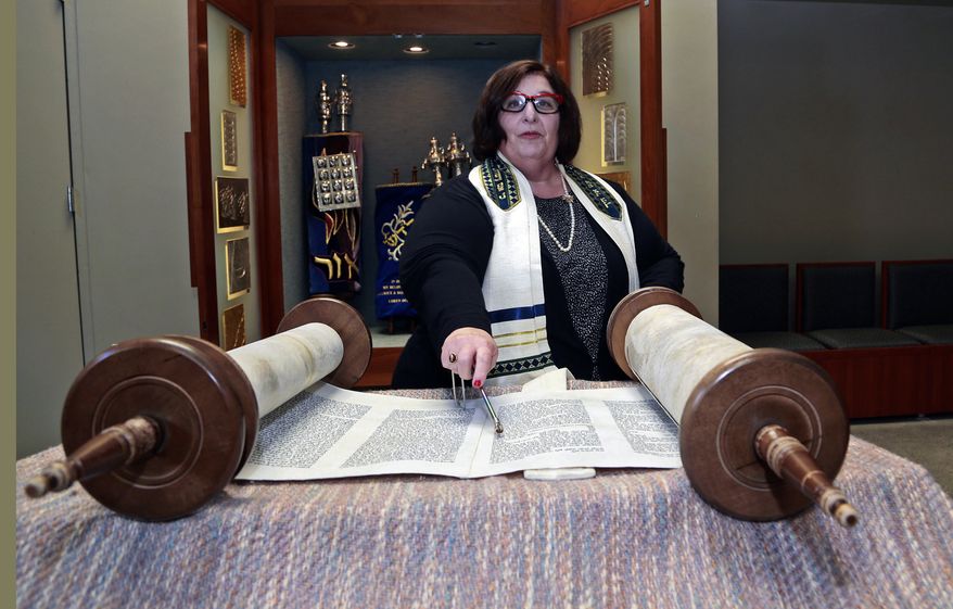 In this March 12, 2015 photo, Rabbi Denise Eger poses at Congregation Kol Ami, a Reform synagogue with gay and lesbian outreach programs, in West Hollywood, Calif. As a rabbinic student in 1980s New York City, Eger quietly started a group for fellow gay and lesbian students. The Reform Jewish movement has traveled a long road toward recognizing and embracing same-sex relationships. That journey has led this week to Philadelphia, where Eger will be installed Monday, March 16, 2015 as the first openly gay president of the Central Conference of American Rabbis, the rabbinical arm of Reform Judaism. (AP Photo/Nick Ut)