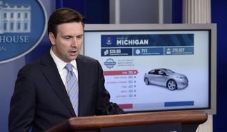 White House press secretary Josh Earnest uses a graphic to discuss the Trans-Pacific Partnership (TPP) during the daily briefing at the White House in Washington, in this Oct. 13, 2015, file photo. Officials released details of a sweeping Pacific Rim trade deal Thursday, Nov. 5, 2015. (AP Photo/Susan Walsh, File)