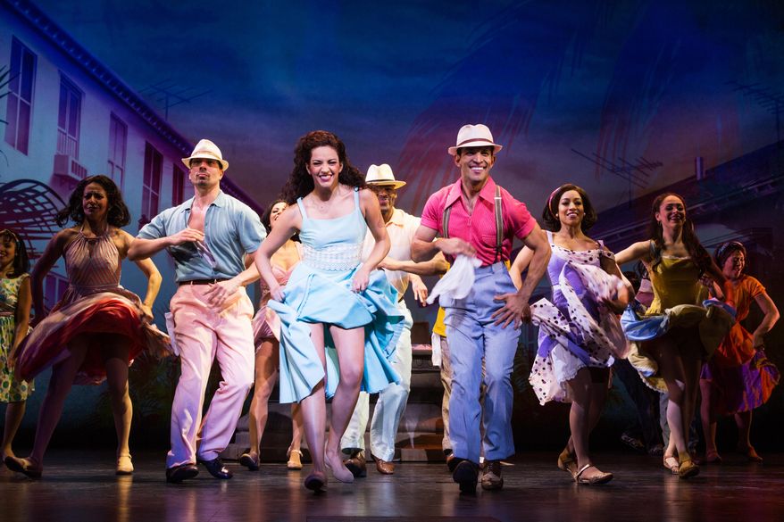 This image released by Vivacity Media Group shows Ana Villafane, center, as Gloria Estefan in the musical "On Your Feet!" (Matthew Murphy/Vivacity Media Group via AP)