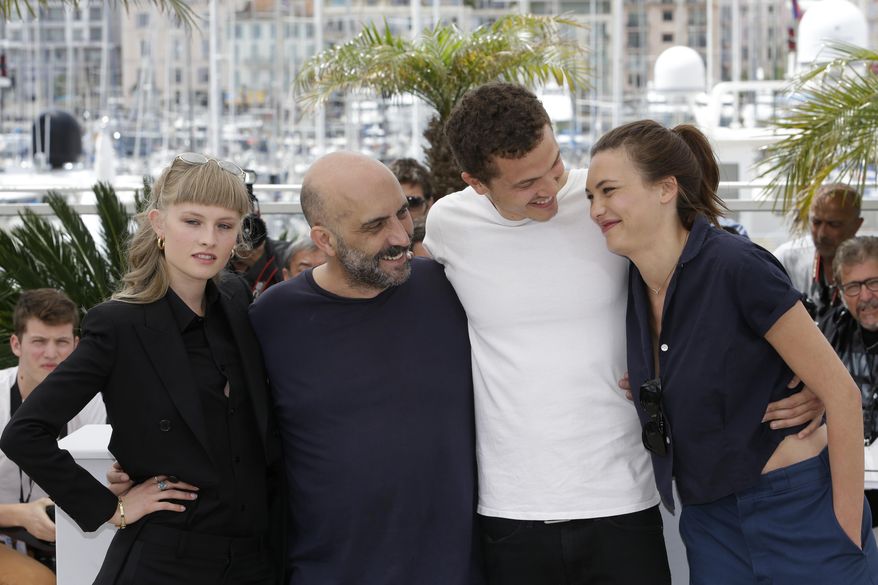 From left, actress Klara Kristin, director Gaspar Noe, actors Karl Glusman, and Aomi Muyock pose for photographers during a photo call for the film Love, at the 68th international film festival, Cannes, southern France, Thursday, May 21, 2015. (AP Photo/Lionel Cironneau)