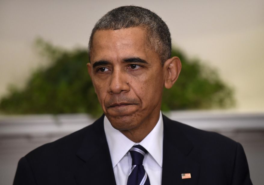 After years of saying he didn't have the power to unilaterally grant a broad amnesty, and after his party was clobbered in the 2014 congressional elections, President Obama reversed himself and decided he did have the power to broaden his deportation amnesty. (Associated Press/File)