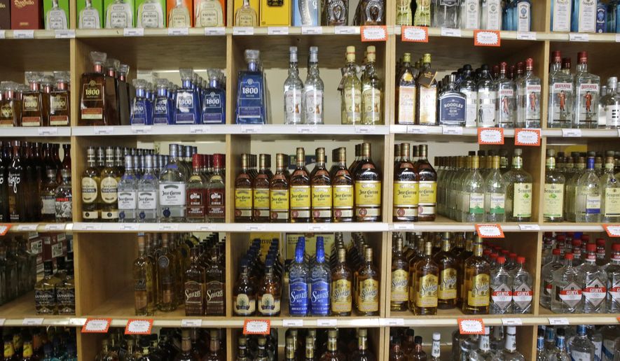 FILE - This July 29, 2014, file photo, shows bottles of liquor at a Utah State Liquor Store in Salt Lake City. New state figures show alcohol sales in Utah increased again in 2015. Data released by the Utah Department of Alcoholic Beverage Control show $396 million in total sales were made in fiscal 2015, which ended June 30. That figure marks an 8 percent rise from 2014 and is more than double a decade ago. (AP Photo/Rick Bowmer, File)