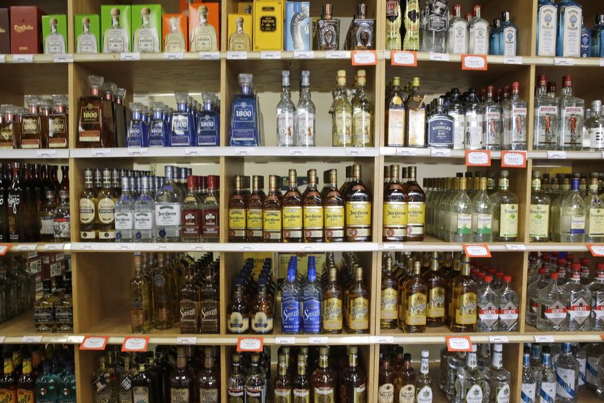 FILE - This July 29, 2014, file photo, shows bottles of liquor at a Utah State Liquor Store in Salt Lake City. New state figures show alcohol sales in Utah increased again in 2015. Data released by the Utah Department of Alcoholic Beverage Control show $396 million in total sales were made in fiscal 2015, which ended June 30. That figure marks an 8 percent rise from 2014 and is more than double a decade ago. (AP Photo/Rick Bowmer, File)