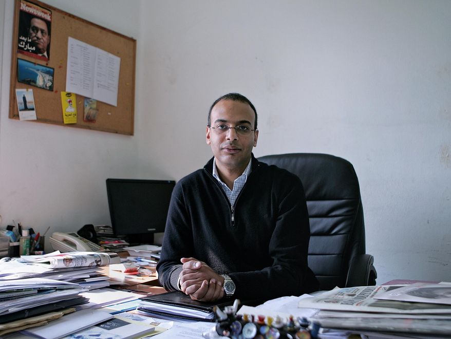 This Dec. 7, 2011 photo, shows Hossam Bahgat in his office at the Egyptian Initiative for Personal Rights in Garden City, Cairo, Egypt. Lawyers for Bahgat, a leading Egyptian investigative journalist and human rights advocate said Monday, Nov. 9, 2015 that the Egyptian military is holding him in an undisclosed location while he faces charges of spreading “false news.” Bahgat was detained Sunday after being summoned to an intelligence building in Cairo. (AP Sarah Rafea via AP) MANDATORY CREDIT