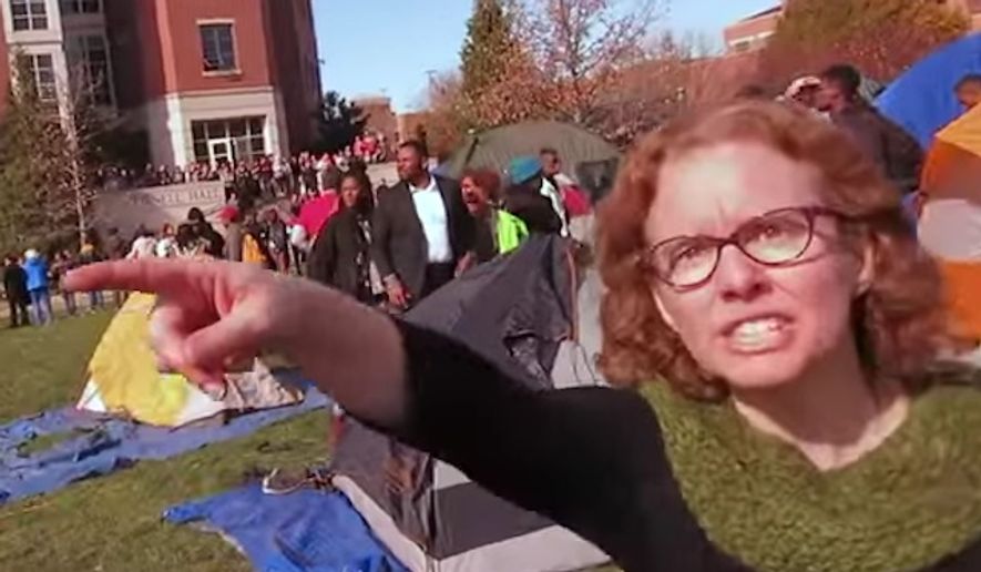 Melissa Click, now a former assistant professor with the University of Missouri Department of Communication, tried to grab a recording device from student reporter Mark Schierbecker. She then called for &quot;muscle&quot; to remove him from filming student protesters in November 2015. (YouTube/@Mark Schierbecker) ** FILE **