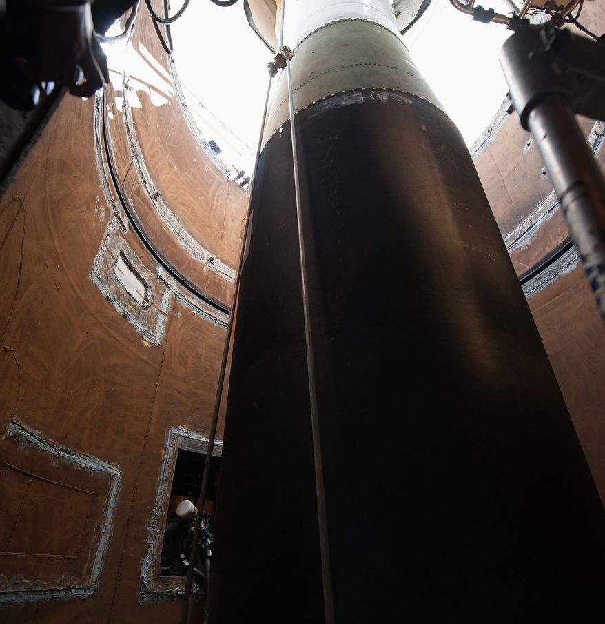 A Minuteman III booster is lowered into the tube at a launch facility in February. Air Force spokesman Ed Gulick said three options were being considered: keeping Minuteman IIIs through 2075; building a new silo-based ICBM; and deploying a mix of Minuteman IIIs and road-mobile missile. (U.S. Air Force)