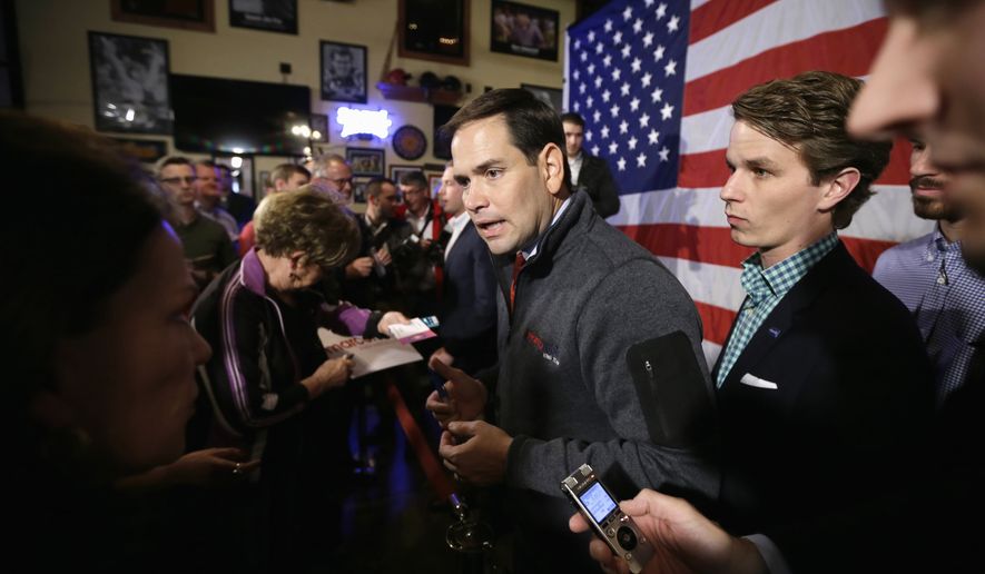 Republican presidential candidate, Sen. Marco Rubio, R-Fla., greets audience members during a meet and greet with local residents, Wednesday, Nov. 11, 2015, in Davenport, Iowa. (AP Photo/Charlie Neibergall)
