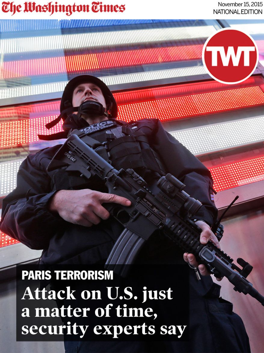 National Edition News cover for November 15, 2015 - Attack on U.S. just a matter of time, security experts say: A heavily armed New York city police officer with the Strategic Response Group stands guard at the armed forces recruiting center in New York's Times Square, Saturday, Nov. 14, 2015. Police in New York say they've deployed extra units to crowded areas of the city "out of an abundance of caution" in the wake of the attacks in Paris, France. A New York Police Department statement released Friday stressed police have "no indication that the attack has any nexus to New York City." (AP Photo/Mary Altaffer)