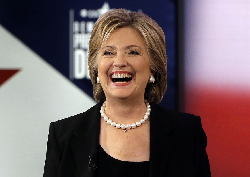 Hillary Rodham Clinton reminded her critics during the Democratic presidential debate Saturday night that she helped Wall Street after the 9/11 attacks. (Associated Press)