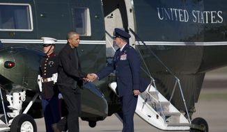 President Barack Obama shakes hands with Col. John C. Millard as he walks from Marine One to board Air Force One, Saturday, Nov. 14, 2015, in Andrews Air Force Base, Md. The president is departing for a nine-day trip to Turkey, the Philippines and Malaysia for global security and economic summits. The global anxiety sparked by a series of deadly attacks in Paris by the Islamic State group has given new urgency to Obama&#39;s upcoming talks with world leaders. (AP Photo/Carolyn Kaster)