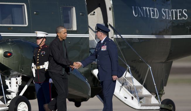 President Barack Obama shakes hands with Col. John C. Millard as he walks from Marine One to board Air Force One, Saturday, Nov. 14, 2015, in Andrews Air Force Base, Md. The president is departing for a nine-day trip to Turkey, the Philippines and Malaysia for global security and economic summits. The global anxiety sparked by a series of deadly attacks in Paris by the Islamic State group has given new urgency to Obama&#x27;s upcoming talks with world leaders. (AP Photo/Carolyn Kaster)