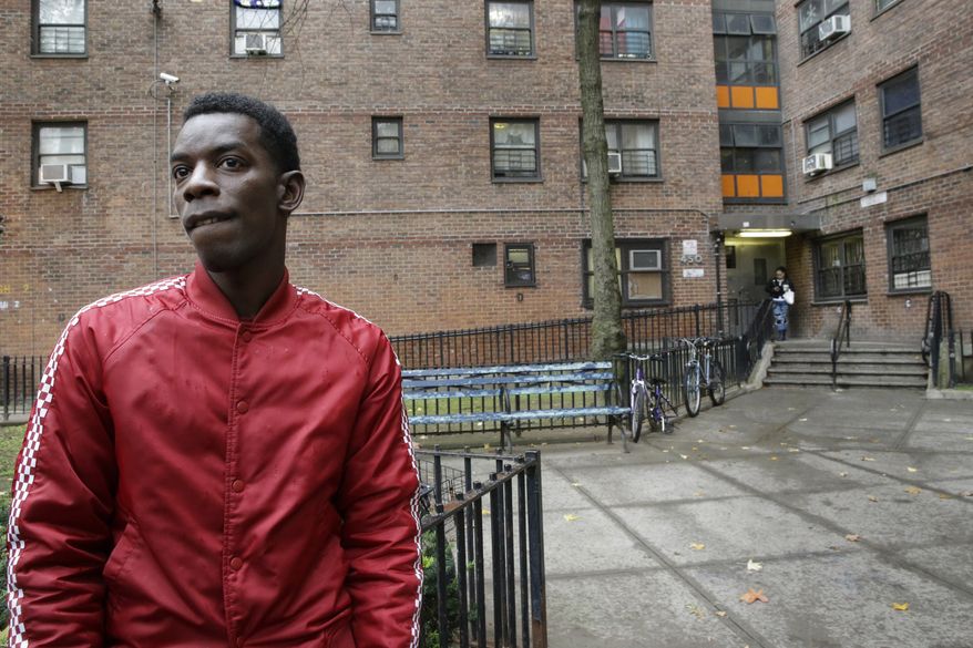 Kaamar Lebrew speaks to The Associated Press outside the New York City Housing Authority's Chelsea-Elliot Houses where he lives, Thursday, Nov. 12, 2015, in New York. The Department of Housing and Urban Development proposed a rule Thursday to require the more than 3,100 public housing agencies across the country to make their properties smoke-free. (AP Photo/Mary Altaffer)