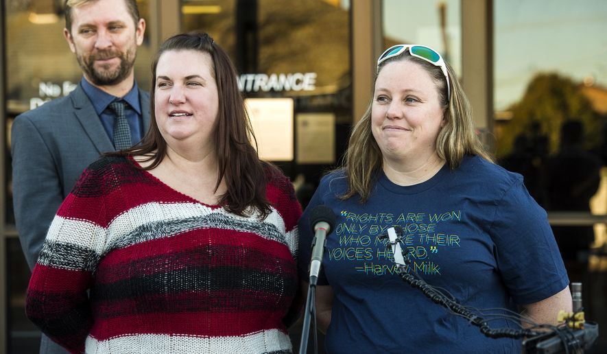 Equality Utah Executive Director Troy Williams, April Hoagland (center) and Beckie Peirce smile during a press conference outside of the Juvenile Court in Price, Utah on Nov. 13, 2015. (The Salt Lake Tribune via Associated Press)