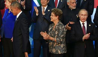 U.S. President Barack Obama, left, Japanese Prime Minister Shinzo Abe, Brazilian President Dilma Rousseff, Indian Prime Minister Narendra Modi and Russian&amp;#8224;President Vladimir Putin leave after posing for a group photo at the G-20 summit in Antalya, Turkey, Sunday, Nov. 15, 2015. President Barack Obama pledged Sunday to redouble U.S. efforts to eliminate the Islamic State group and end the Syrian civil war that has fueled its rise, denouncing the extremist group&#39;s horrifying terror spree in Paris as &quot;an attack on the civilized world.&quot; (AP Photo/Lefteris Pitarakis)