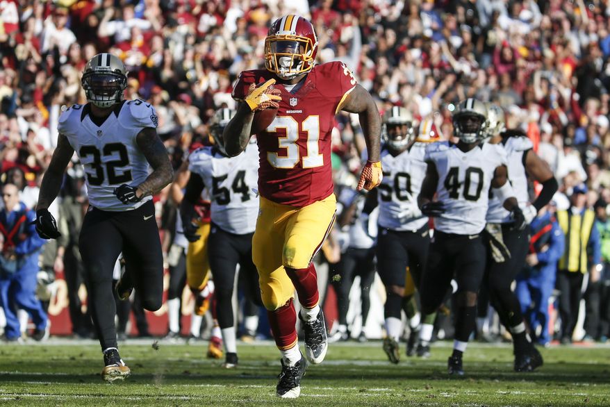 Washington Redskins running back Matt Jones (31) outpaces the New Orleans Saints defense to score a 78 yard touchdown during the first half of an NFL football game in Landover, Md., Sunday, Nov. 15, 2015. (AP Photo/Evan Vucci)