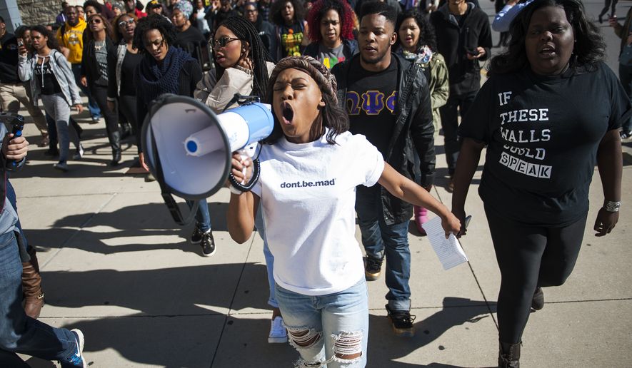 Concerned Student 1950 member Ayanna Poole uses a megaphone while leading a &quot;We Are Not Afraid&quot; march including local and regional campuses Friday, Nov. 13, 2015 on Rollins Street on the University of Missouri campus in Columbia, Mo. (Daniel Brenner/Columbia Daily Tribune via AP) MANDATORY CREDIT