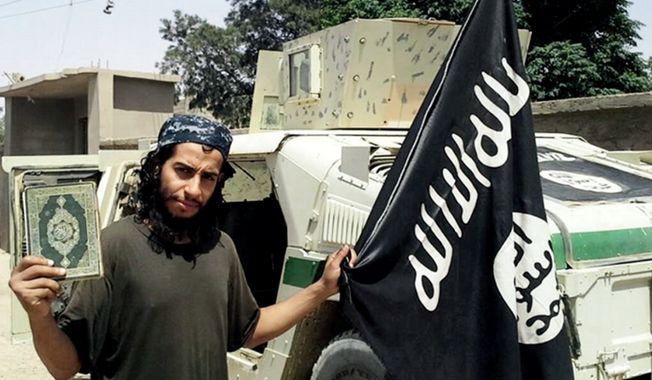 This undated image made available in the Islamic State&#x27;s English-language magazine Dabiq, shows Abdelhamid Abaaoud, who grew up in the Molenbeek-Saint-Jean neighborhood of Belgian capital. Abaaoud  was identified by French authorities on Monday as the presumed mastermind of the terror attacks Friday in Paris.