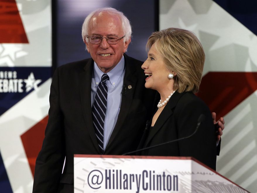 Hillary Rodham Clinton, right, talks to Bernie Sanders after a Democratic presidential primary debate, Saturday, Nov. 14, 2015, in Des Moines, Iowa. (AP Photo/Charlie Neibergall) ** FILE **