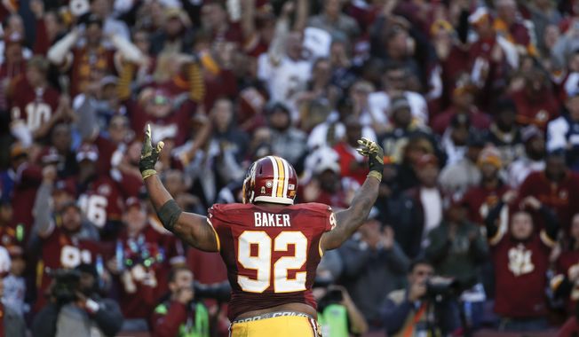 Washington Redskins defensive end Chris Baker (92) celebrates a play during the second half of an NFL football game against the New Orleans Saints in Landover, Md., Sunday, Nov. 15, 2015. (AP Photo/Alex Brandon)
