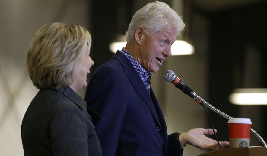 Democratic presidential candidate Hillary Rodham Clinton listens to her husband, former President Bill Clinton, speak at the Central Iowa Democrats Fall Barbecue Sunday, Nov. 15, 2015, in Ames, Iowa. (Associated Press)
