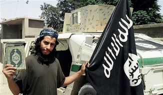 This undated image made available in the Islamic State&#39;s English-language magazine Dabiq, shows Belgian national Abdelhamid Abaaoud. Abaaoud, the child of Moroccan immigrants who grew up in the Belgian capital’s Molenbeek-Saint-Jean neighborhood, was identified by French authorities on Monday Nov. 16, 2015, as the presumed mastermind of the terror attacks last Friday in Paris that killed over a hundred people and injured hundreds more. (Militant Photo via AP)