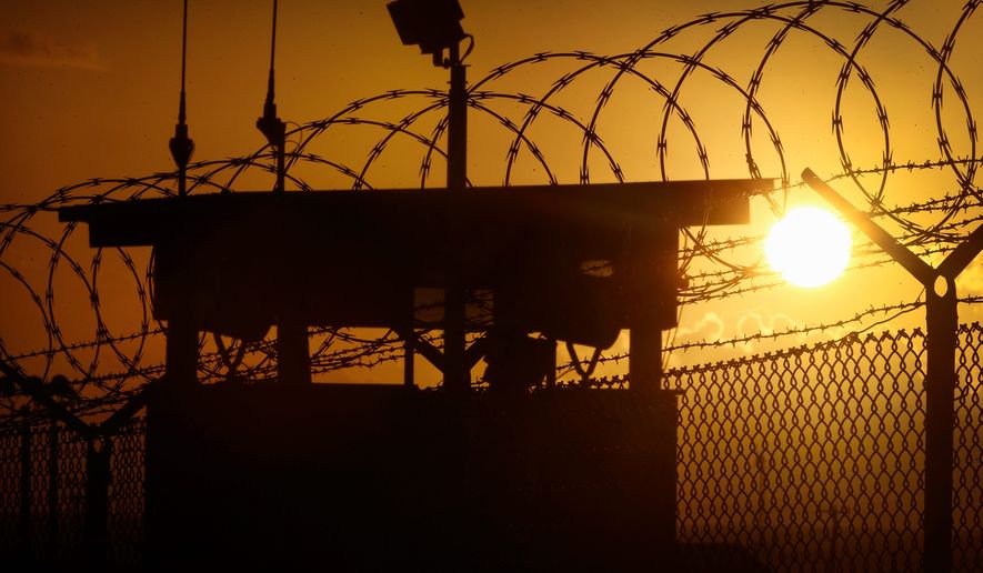 Thirteen years after it opened and almost seven years after President Obama pledged to have it shut down, the sun still rises over Camp Delta at Guantanamo Bay Naval Base in Cuba. After the release of five Yemeni men to the United Arab Emirates this weekend, the Guantanamo prison population stands at 107 detainees. (Associated Press photographs)