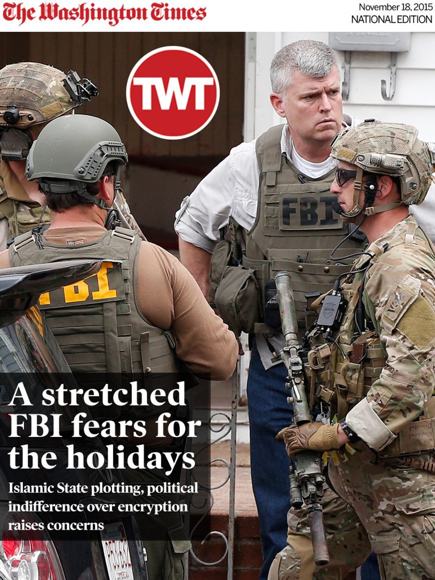 National Edition News cover for November 18, 2015 - A stretched FBI fears for the holidays: Heavily armed FBI agents gather next door to 410 Norfolk Street in Cambridge, Mass., Friday, April 19, 2013. Two suspects in the Boston Marathon bombing killed an MIT police officer, injured a transit officer in a firefight and threw explosive devices at police during a getaway attempt in a long night of violence that left one of them dead and another still at large Friday, authorities said as the manhunt intensified for a young man described as a dangerous terrorist. (AP Photo/Michael Dwyer)