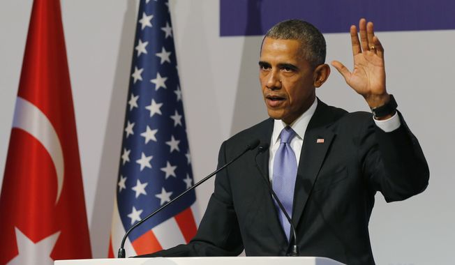 U.S. President Barack Obama gestures to journalists following a news conference at the end of the G-20 summit in Antalya, Turkey, Monday, Nov. 16, 2015. The leaders of the Group of 20 wrapped up their two-day summit near the Turkish Mediterranean coastal city of Antalya Monday against the backdrop of heavy French bombardment of the Islamic State&#x27;s stronghold in Syria. The bombings marked a significant escalation of France&#x27;s role in the fight against the extremist group. (Anadolu Agency via AP, Pool)