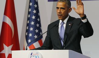 U.S. President Barack Obama gestures to journalists following a news conference at the end of the G-20 summit in Antalya, Turkey, Monday, Nov. 16, 2015. The Paris terror attacks have sparked widespread calls from congressional Republicans to end or limit U.S. refugee admissions from Syria, with some threatening to use critical spending legislation as leverage weeks from a must-pass deadline. That could allow Republicans to block Obama&#x27;s goal of bringing 10,000 more Syrian refugees to the U.S. during this budget year.  (Anadolu Agency via AP, Pool)
