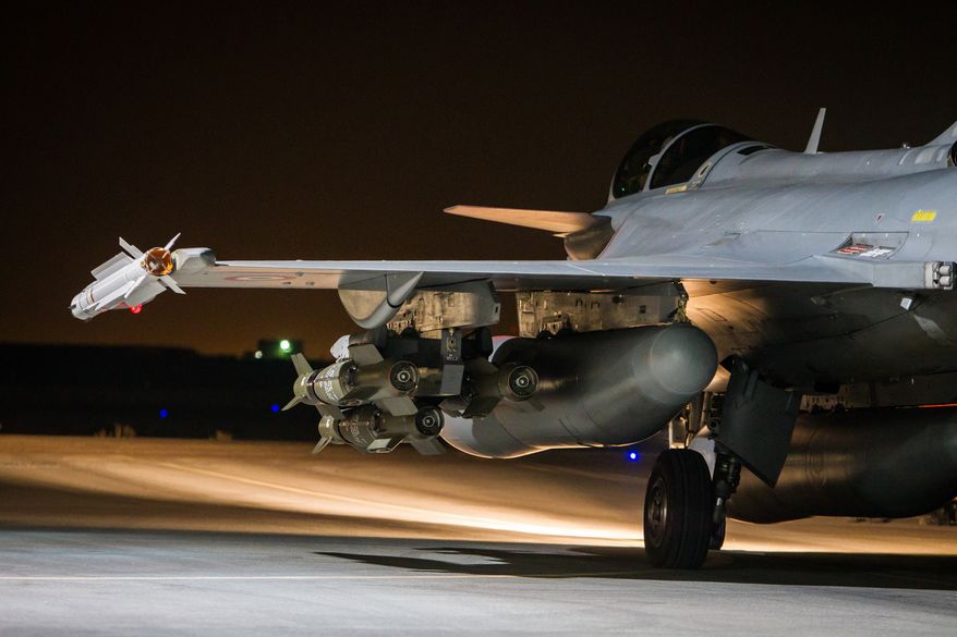 This photo released on Tuesday, Nov. 17, 2015 by the French Army Communications Audiovisual office (ECPAD) shows a French army Rafale jet on the tarmac of an undisclosed air base as part of France's Operation Chammal launched in September 2015 in support of the US-led coalition against Islamic State group. France launched fresh airstrikes on the Islamic State stronghold of Raqqa in Syria days after attacks in Paris linked to the group killed at least 129 people. (Sebastien Dupont/ECPAD via AP)