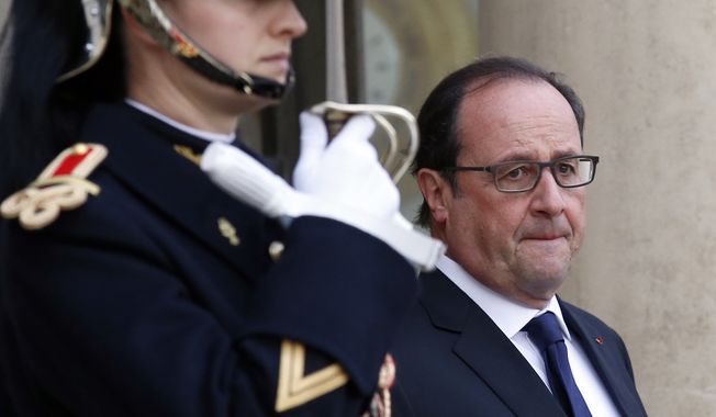 French President Francois Hollande waits for the arrival of US Secretary of State John Kerry at the Elysee Palace, in Paris, France, Tuesday, Nov. 17, 2015. Kerry arrived in Paris to pay tribute to last Friday November 13 attacks in France. (AP Photo/Francois Mori)